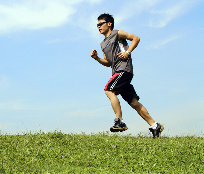 Is it better to run on grass or road?
