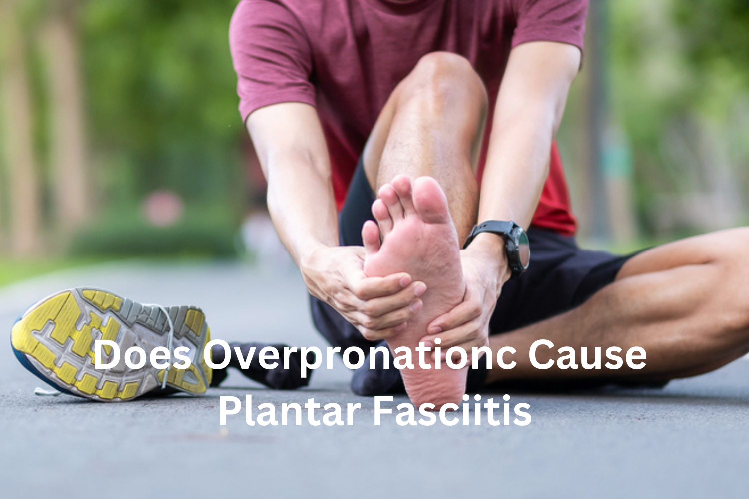 runner sitting on the road checking his foot for plantar fasciitis