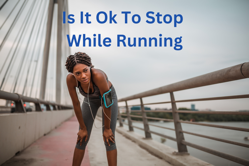 lady stopped on bridge while running